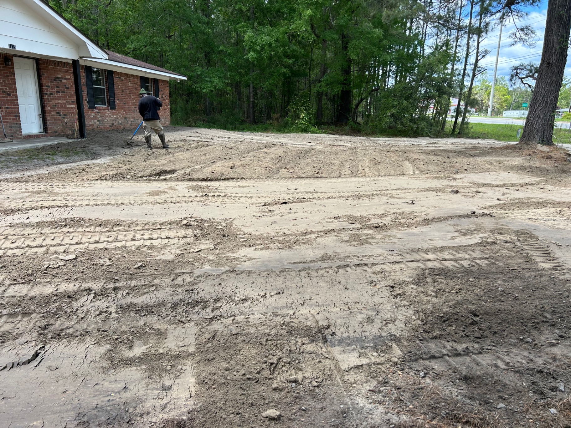 Operator finishing grade on a prepped building site