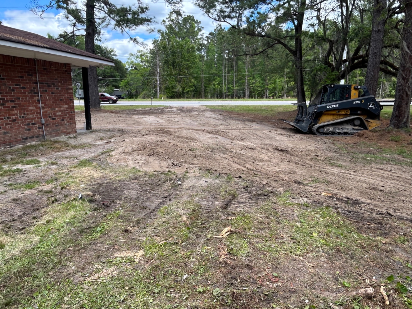 Skid steer on a freshly cleared lot in Coastal Georgia